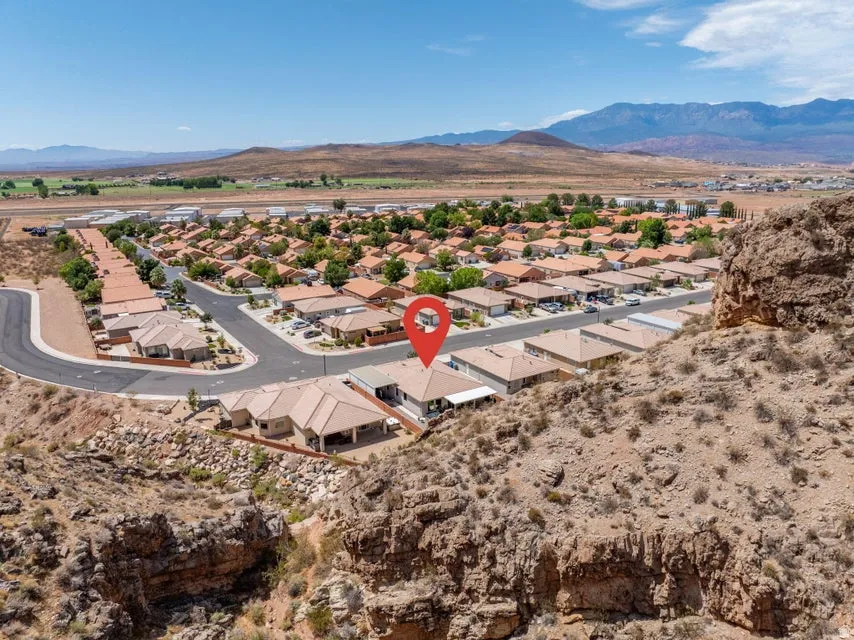 Property situated within a residential community featuring consistent architectural styling and tile roofing