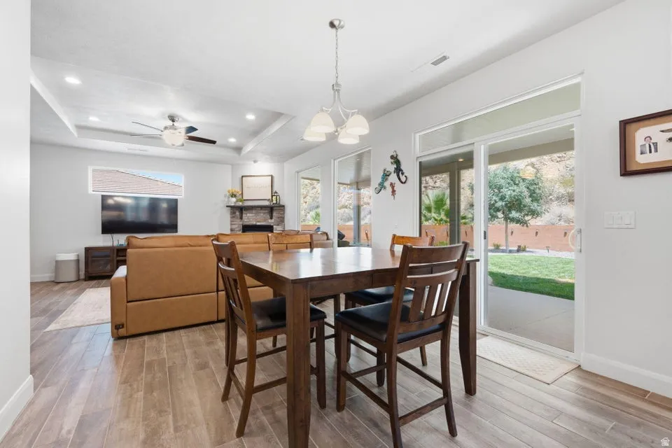 Open-concept living space featuring wood-finish flooring throughout