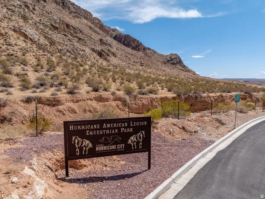 Hurricane American Legion Equestrian Park entrance sign with desert landscaping and a paved road