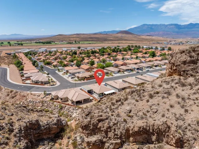 Property situated within a residential community featuring consistent architectural styling and tile roofing