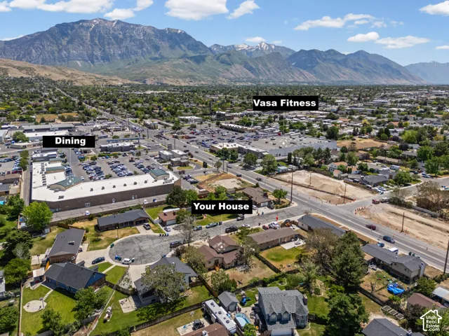 Aerial view showcasing this residential property situated in a thriving neighborhood with convenient access to dining and fitness amenities