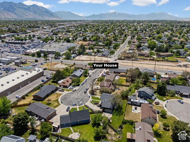 Aerial view showcasing this residential property situated on a corner lot within an established neighborhood