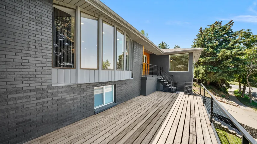 Modern composite deck featuring wide planking and clean lines, seamlessly extending the home's contemporary design