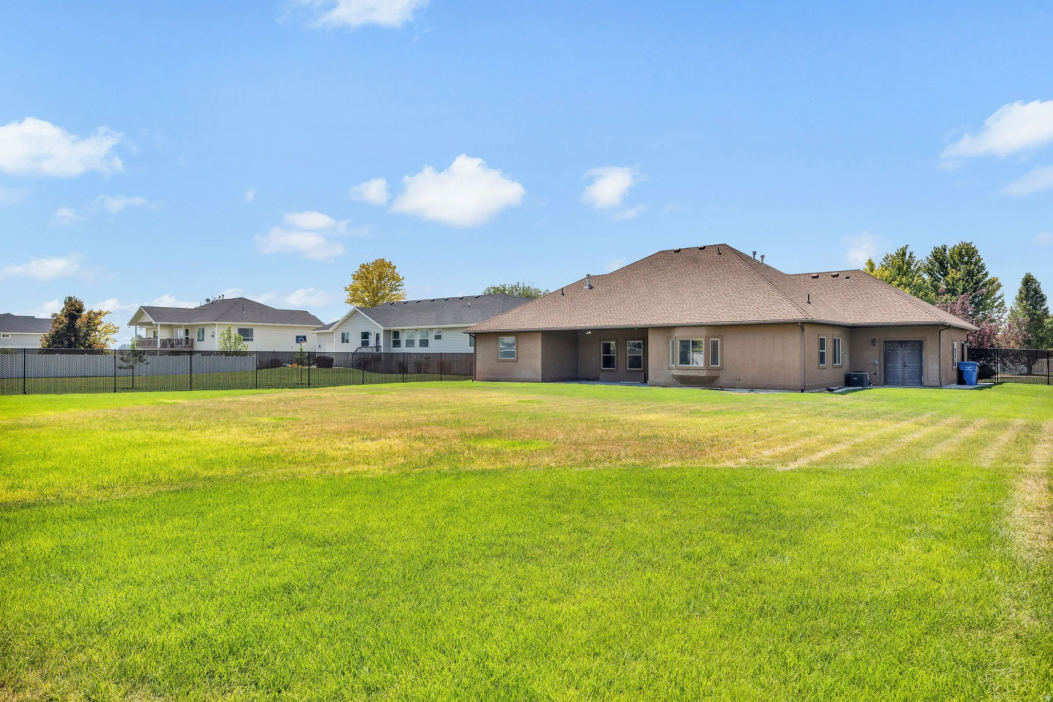 Expansive green lawn providing abundant outdoor space