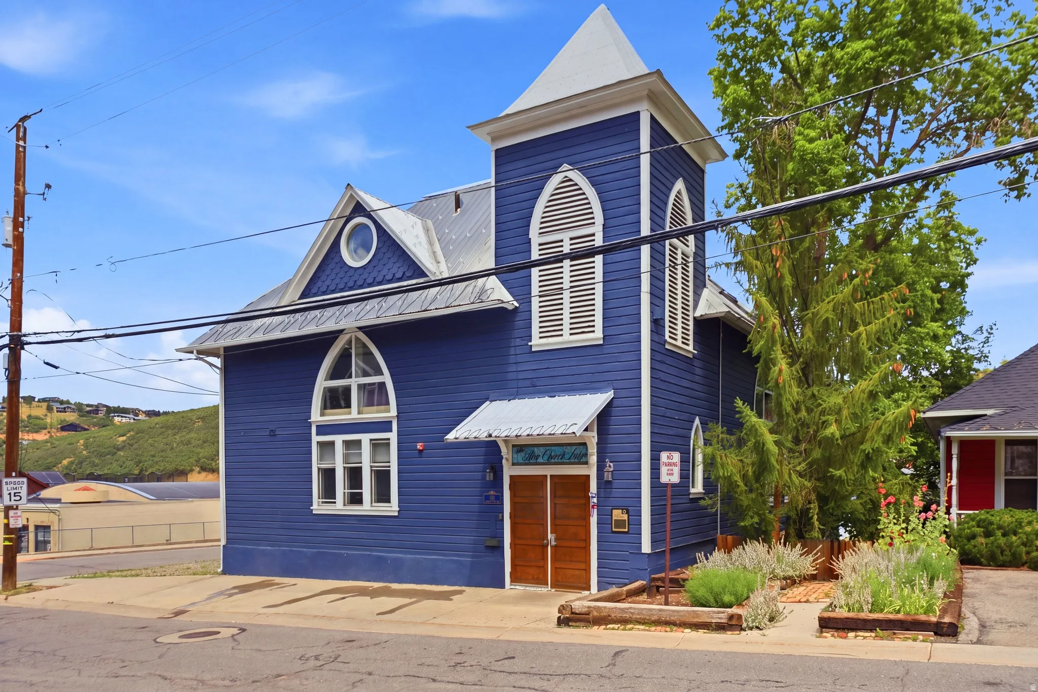 Blue exterior facade featuring a prominent steeple