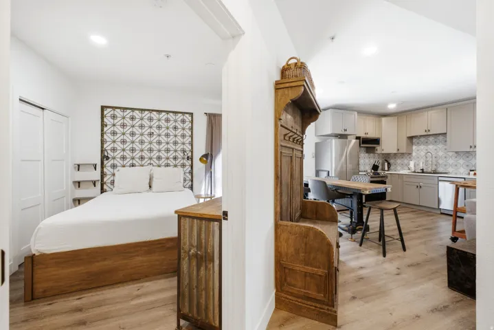 Open-concept living area featuring wood-finish flooring throughout