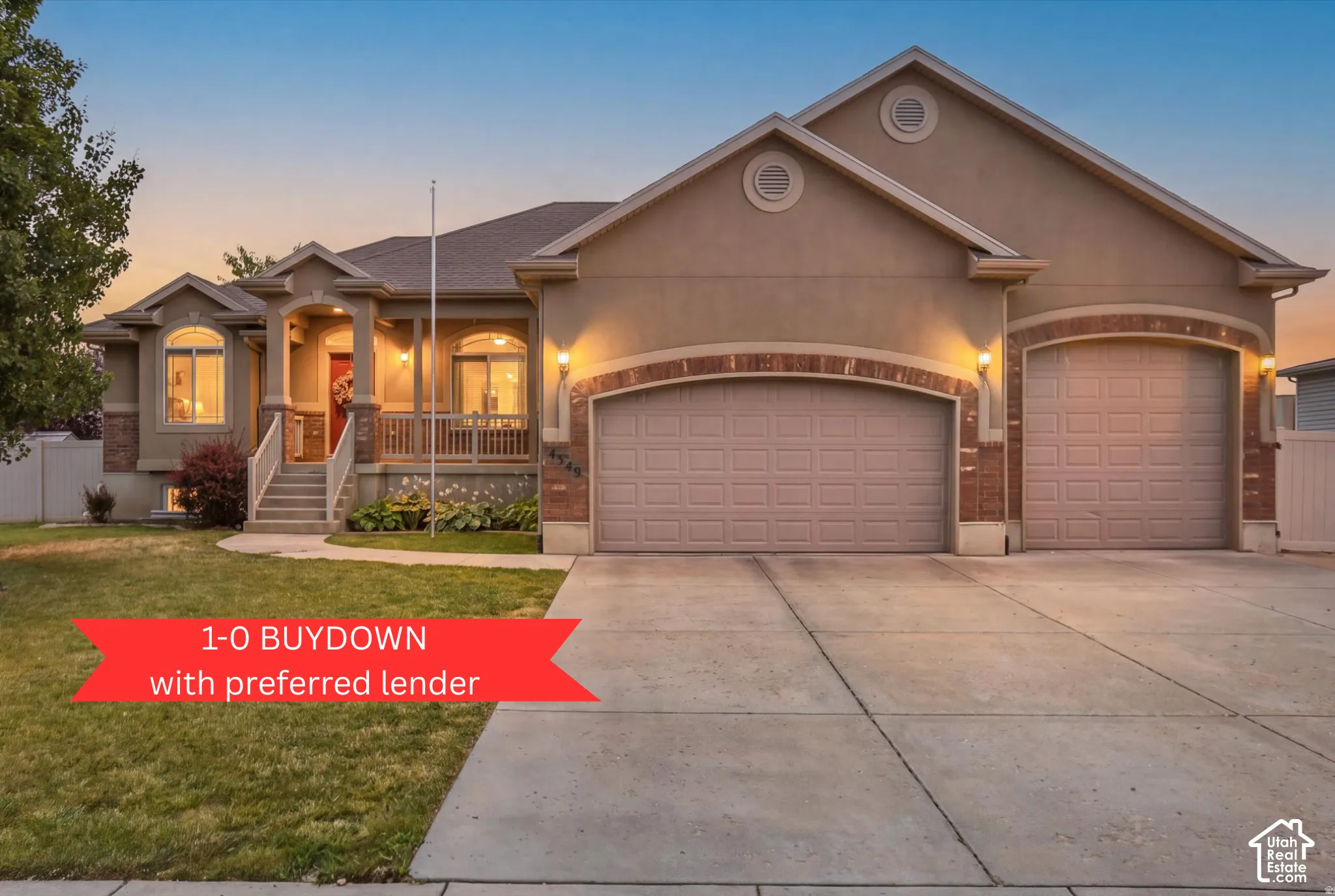 Stucco exterior featuring brick accents, arched garage entries, a covered front porch with railing, and an attached three-car garage