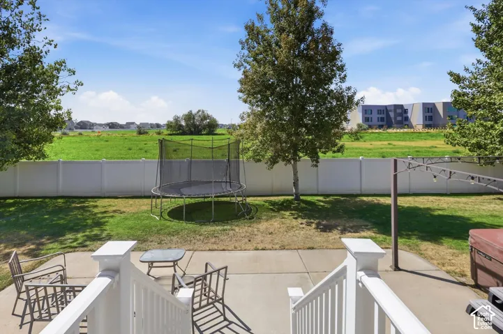 Concrete patio, fenced yard and spacious views