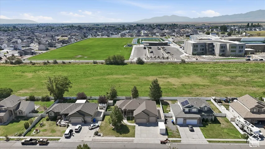 Aerial perspective showcasing homes with a field for spacious views