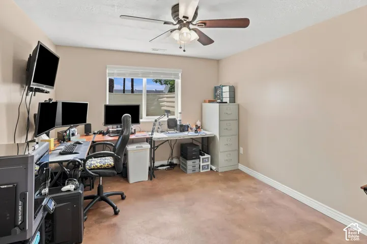 Basement bedroom with stained concrete flooring