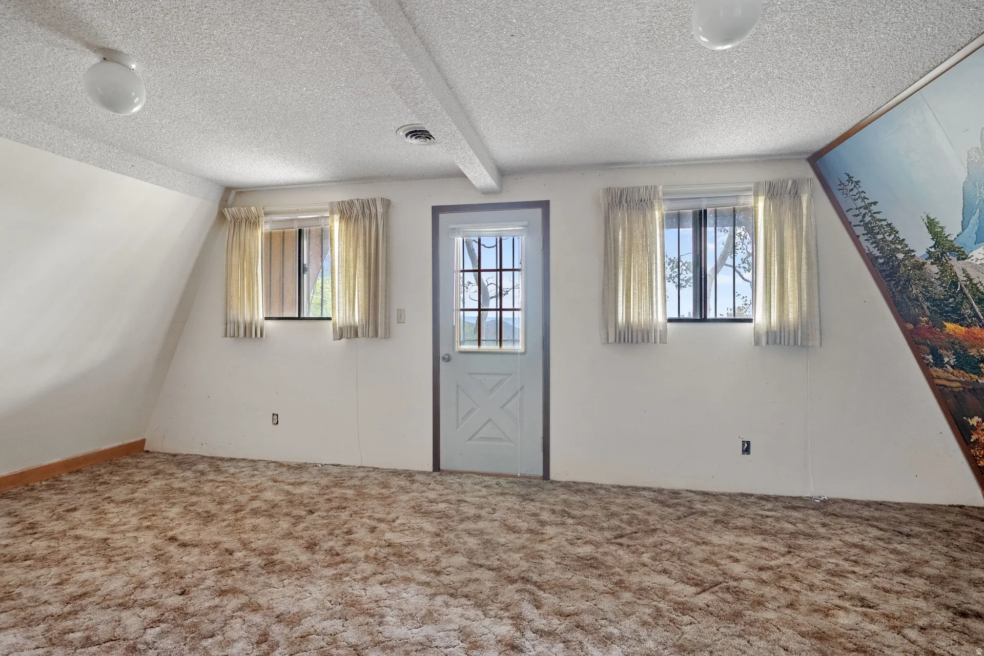 Bedroom 2 with a beautiful view and area ready for a new 2nd level deck to be installed by new owner.