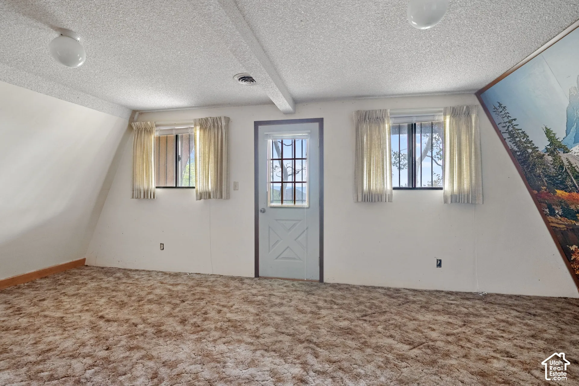 Bedroom 2 with a beautiful view and area ready for a new 2nd level deck to be installed by new owner.