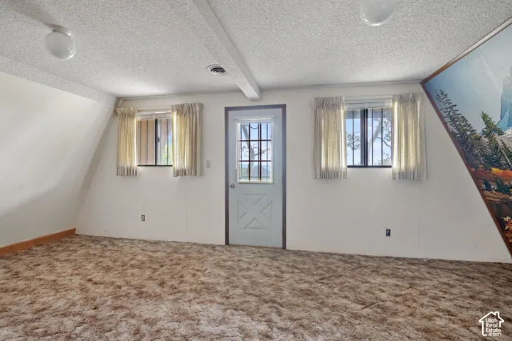 Bedroom 2 with a beautiful view and area ready for a new 2nd level deck to be installed by new owner.