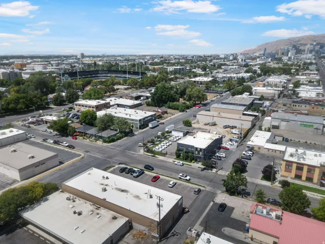 Aerial view showcasing industrial and commercial mixed-use property with multiple warehouse and manufacturing structures featuring flat roofs and functional layouts