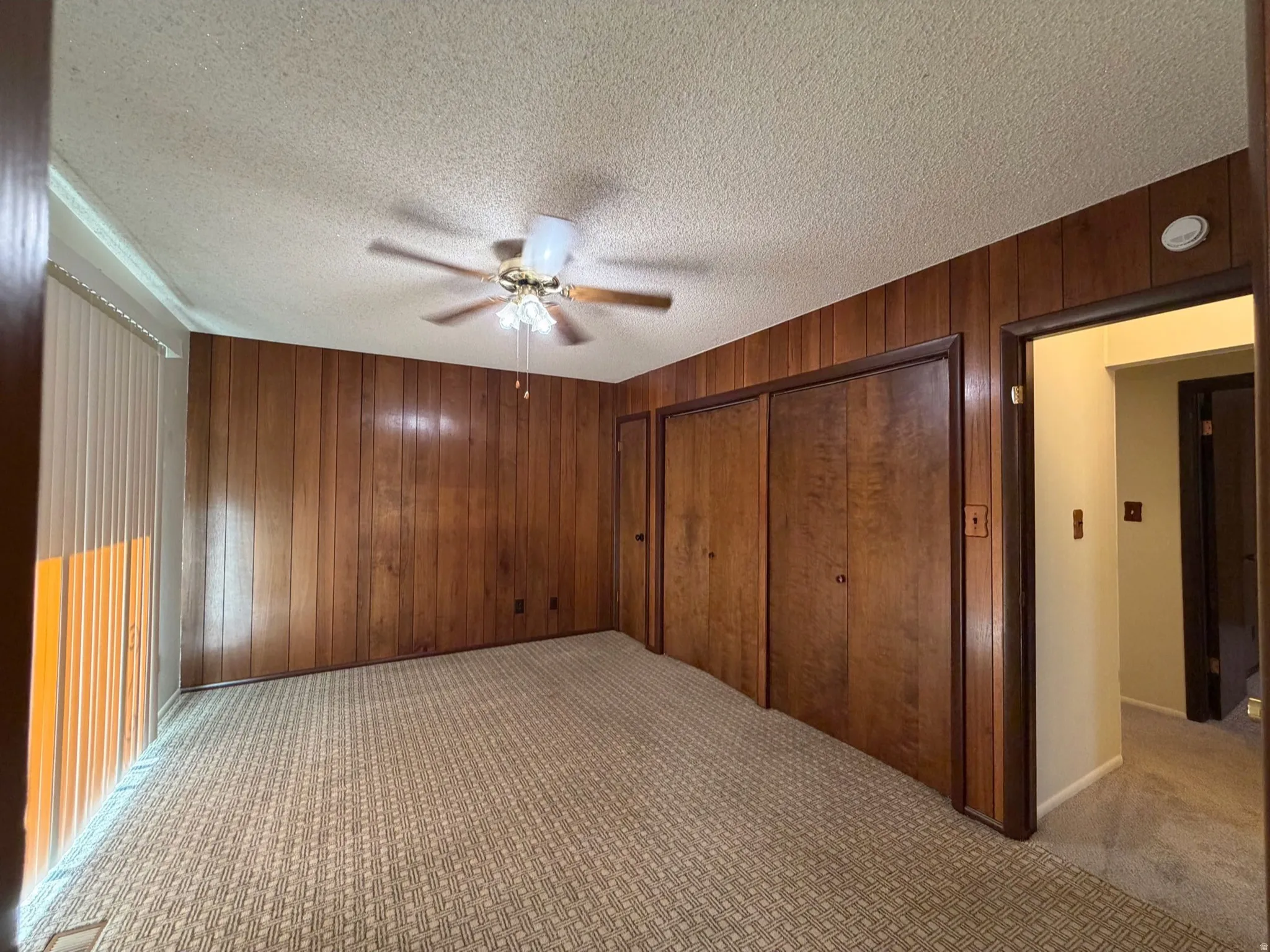 Primary bedroom with access to deck and private bath.