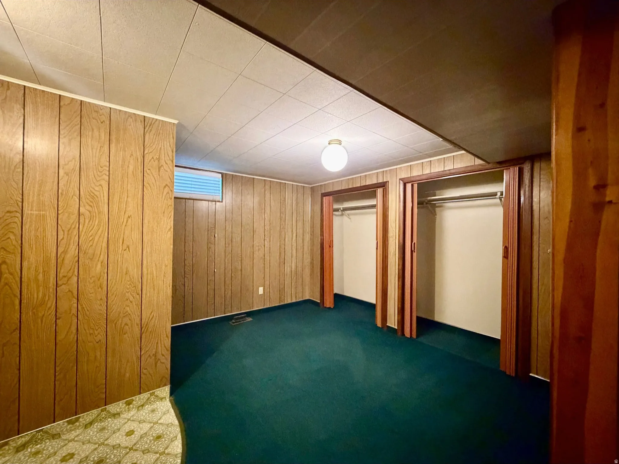 Paneled bedroom with double closets