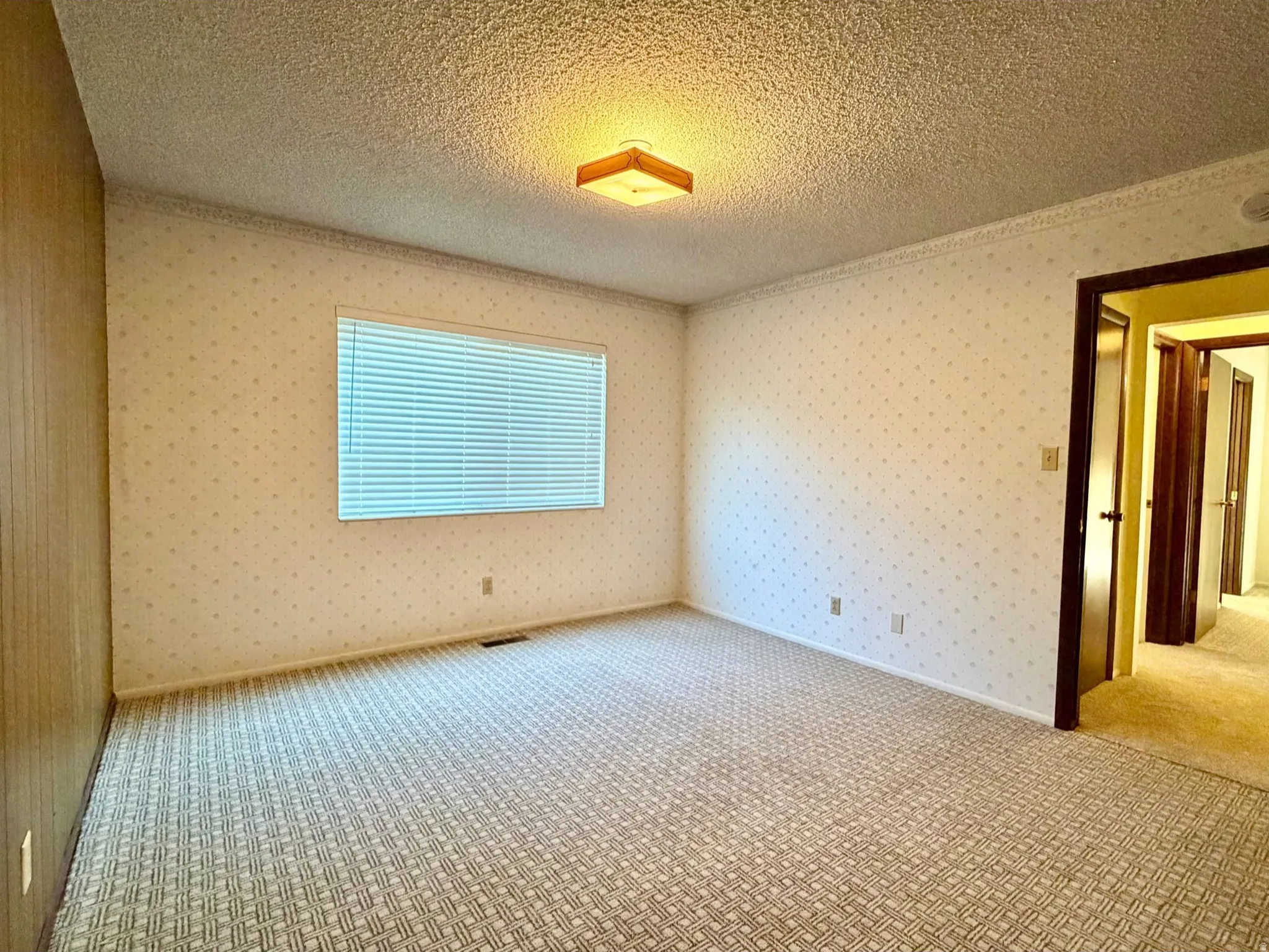 Bright bedroom featuring main floor convenience
