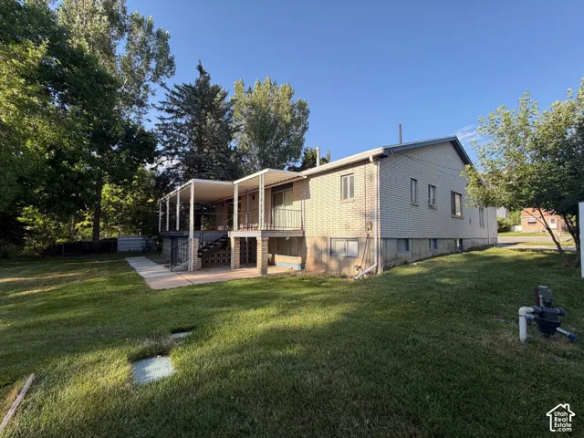 Brick exterior featuring a two-story structure with multiple windows, Irrigation water included.