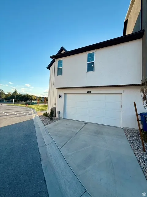 Modern exterior featuring white stucco and black trim accents