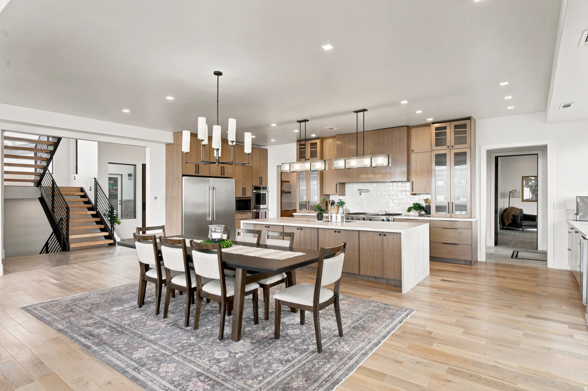 Open-concept living space featuring light wood-finish flooring