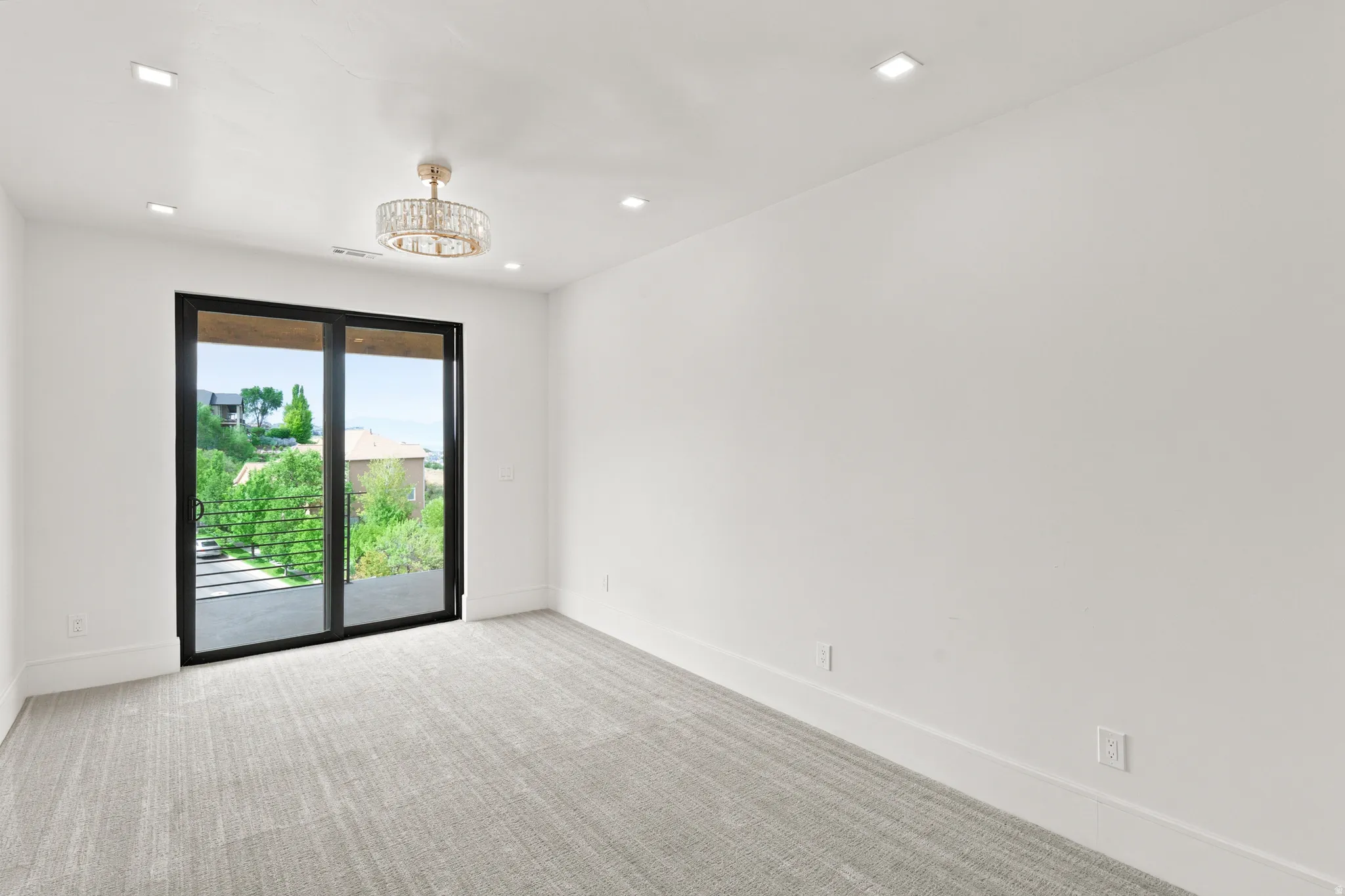 Sliding glass doors opening to an exterior balcony