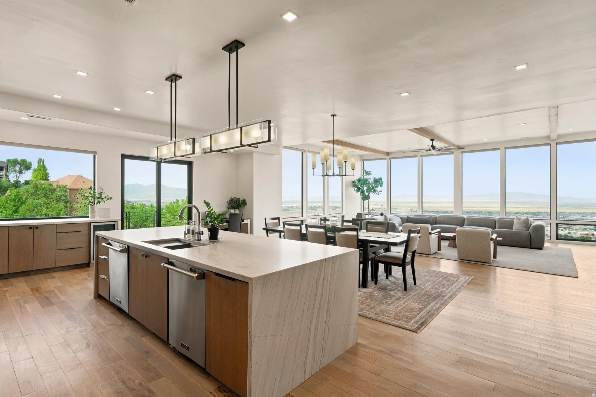 Open-concept living space featuring wood-finish flooring throughout