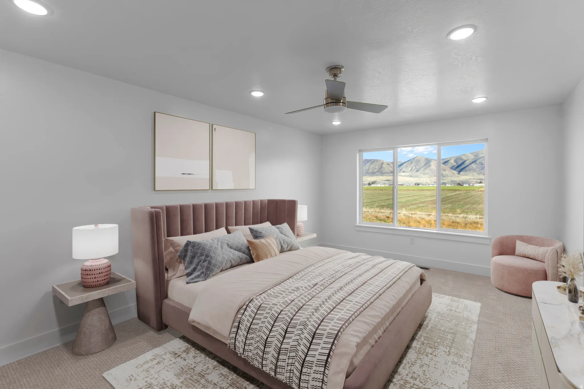 Spacious primary bedroom featuring a tufted upholstered headboard in mauve, recessed ceiling lighting, and a ceiling fan