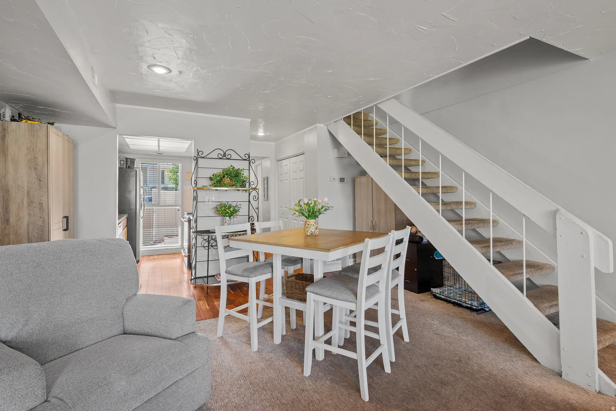 Interior staircase with carpeted treads and white risers