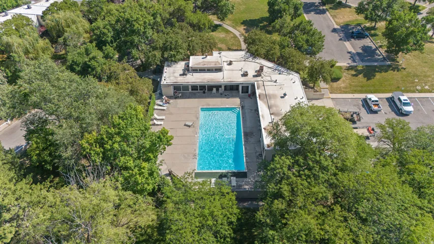 Outdoor swimming pool surrounded by a concrete deck