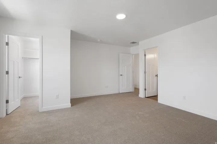 Neutral-toned carpeting throughout