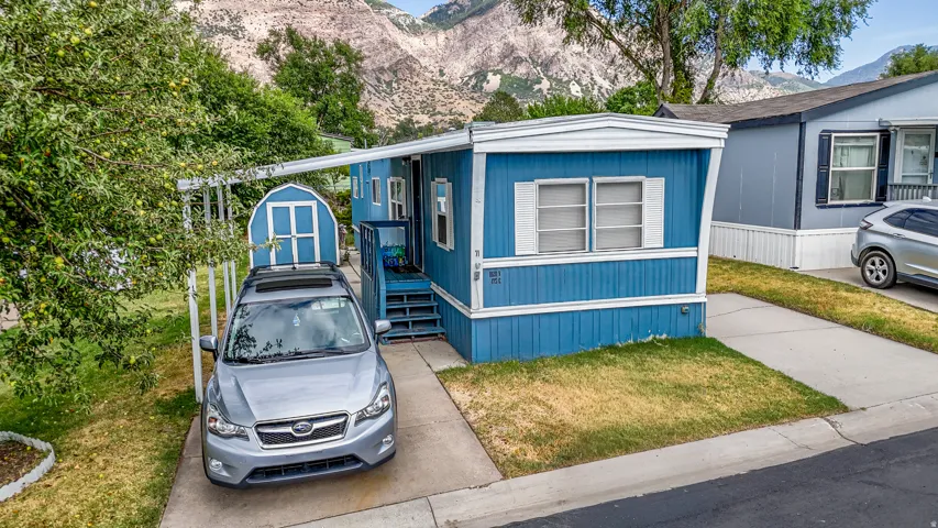 Blue exterior with white trim and shutters