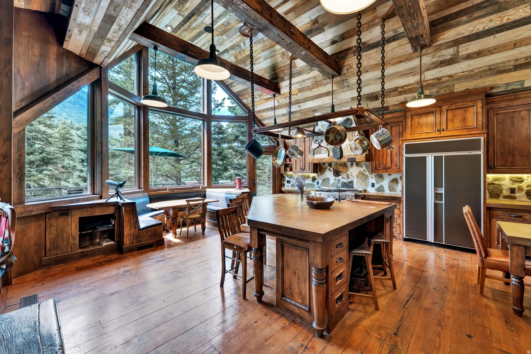Vaulted ceiling with exposed wood beams and plank paneling