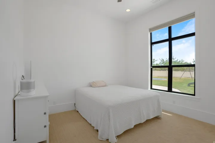 High ceilings featuring recessed lighting and a ceiling fan