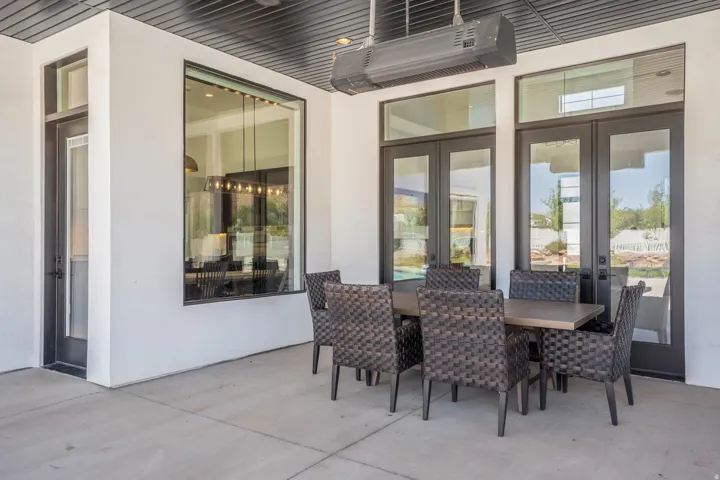 Covered patio featuring a concrete slab and a built-in overhead heater