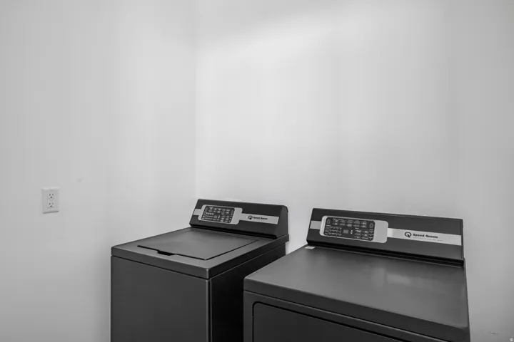 Dedicated laundry area featuring a washer and dryer set