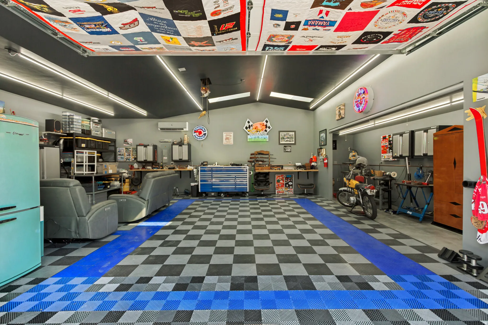 Detached rear Workshop/Garage, approximately 948 sq ft.and features insulated overhead doors, professionally installed copper compressed-air lines around the perimeter, a dedicated ventilated room for grinding and sanding, abundance of electrical outlets.