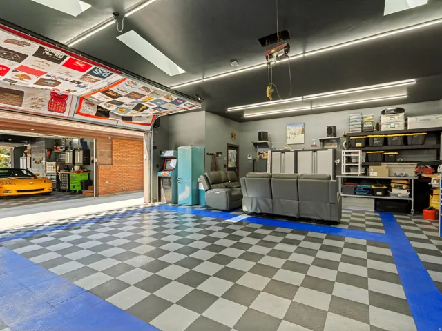 Detached rear Workshop/Garage, approximately 948 sq ft.and features insulated overhead doors, professionally installed copper compressed-air lines around the perimeter, a dedicated ventilated room for grinding and sanding, abundance of electrical outlets.