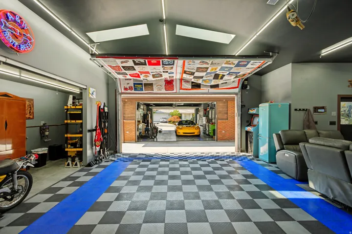 Detached rear Workshop/Garage, approximately 948 sq ft.and features insulated overhead doors, professionally installed copper compressed-air lines around the perimeter, a dedicated ventilated room for grinding and sanding, abundance of electrical outlets.