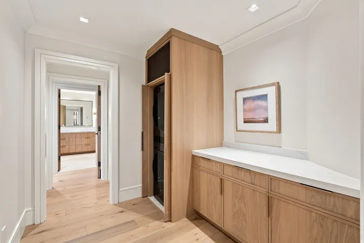 Hallway featuring wood-finish flooring and recessed lighting