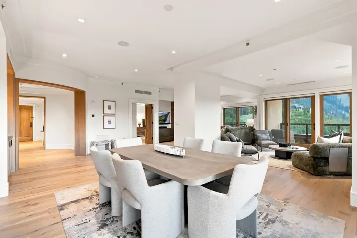 Dining area featuring wood-finish flooring, recessed lighting, and an expansive sliding glass door system