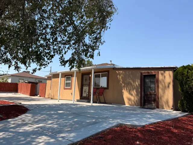 Exterior stucco finish with a flat roofline