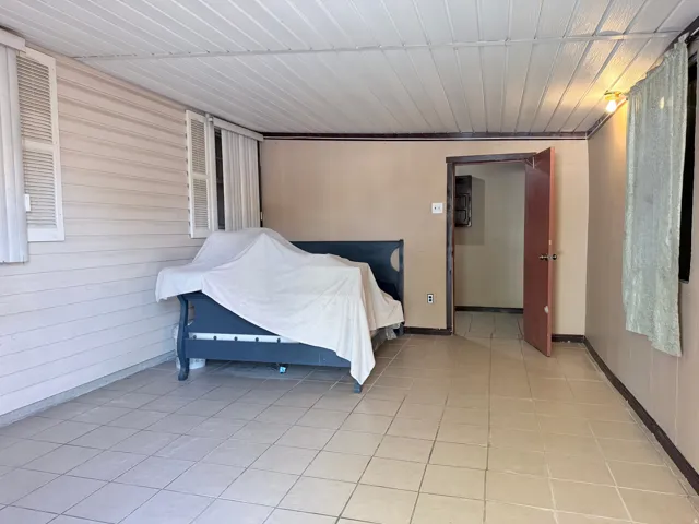 Tile flooring extending throughout the space