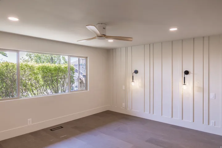 Wood-finish flooring, recessed lighting, and a ceiling fan