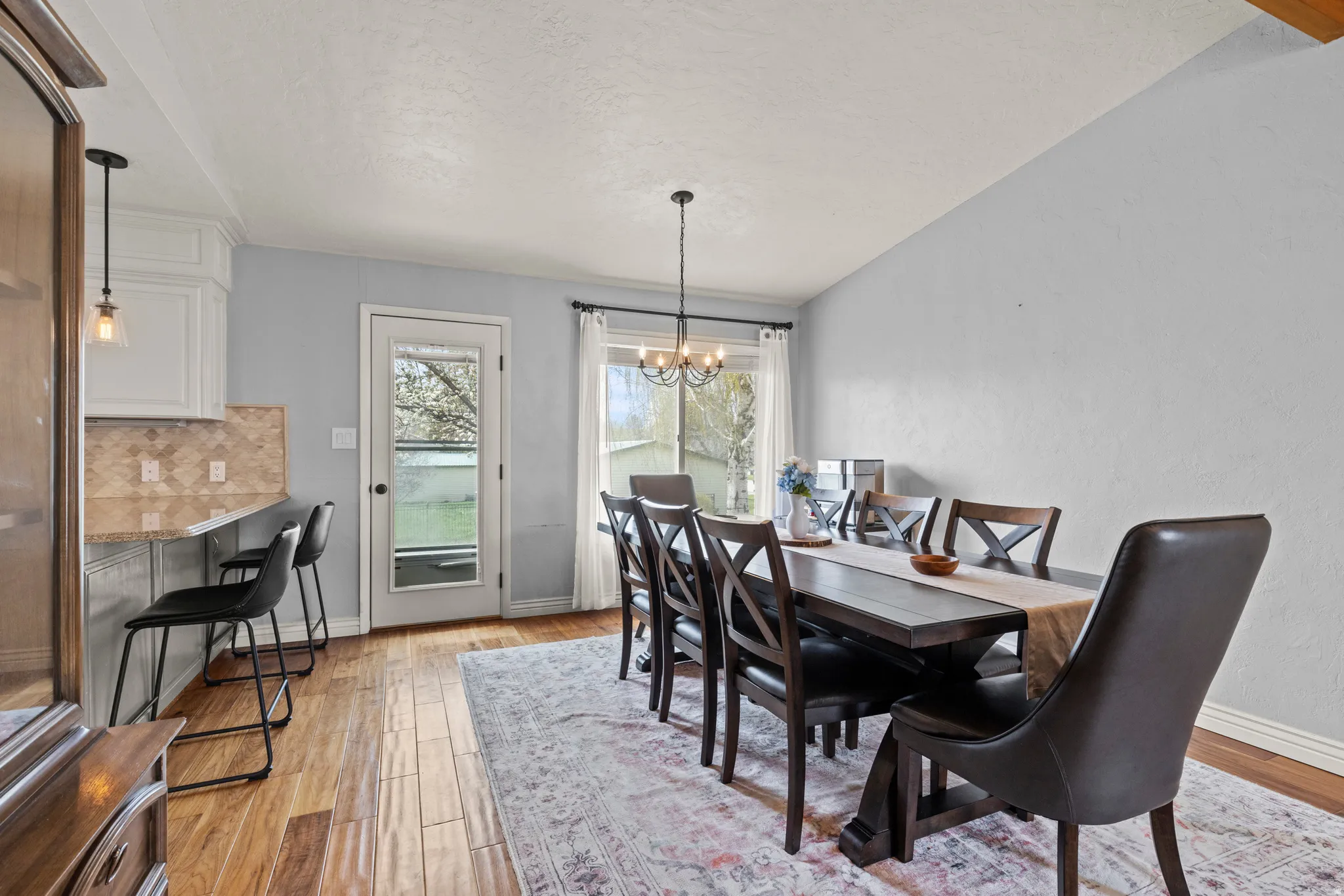 Wood-finish flooring throughout the dining area