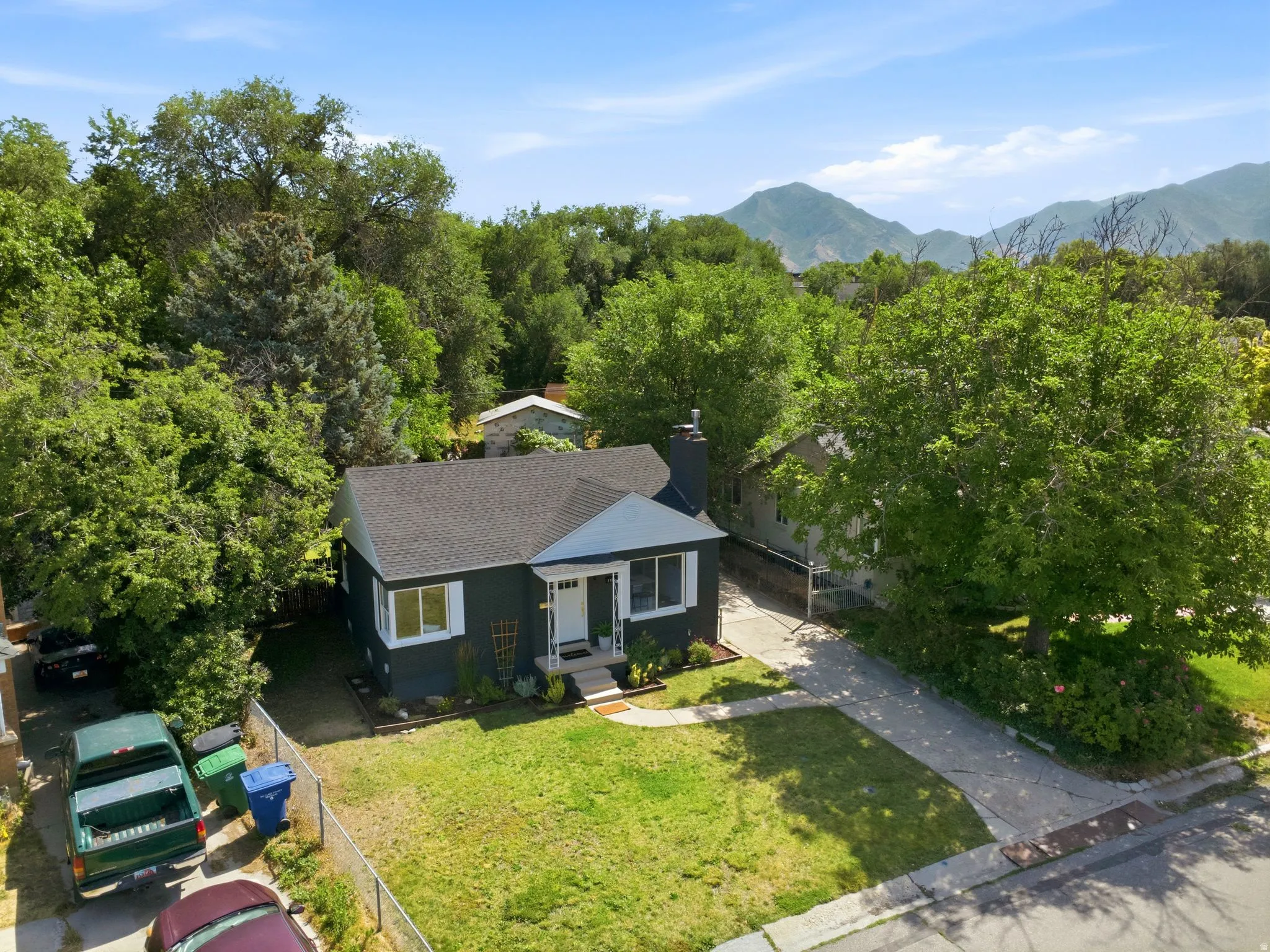 Charming single-story residence nestled on a generous lot surrounded by mature landscaping