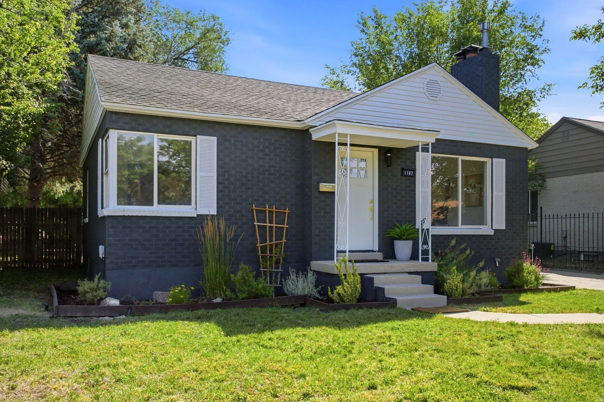 Charcoal brick exterior with white trim details