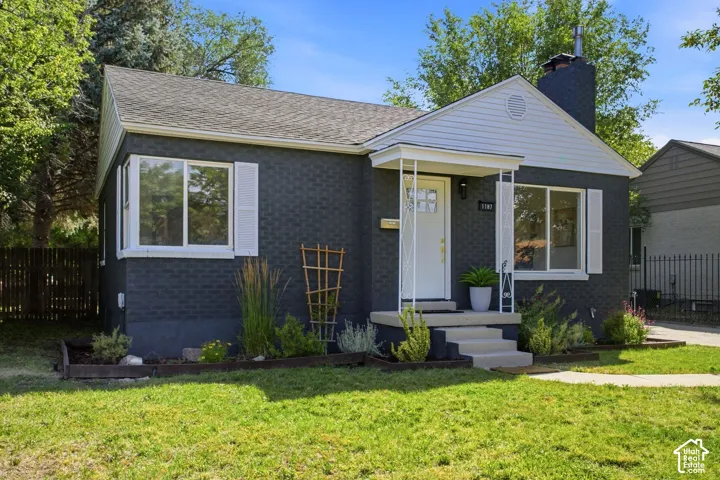 Charcoal brick exterior with white trim details