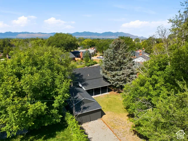 Aerial perspective showcasing a residential property and surrounding landscape