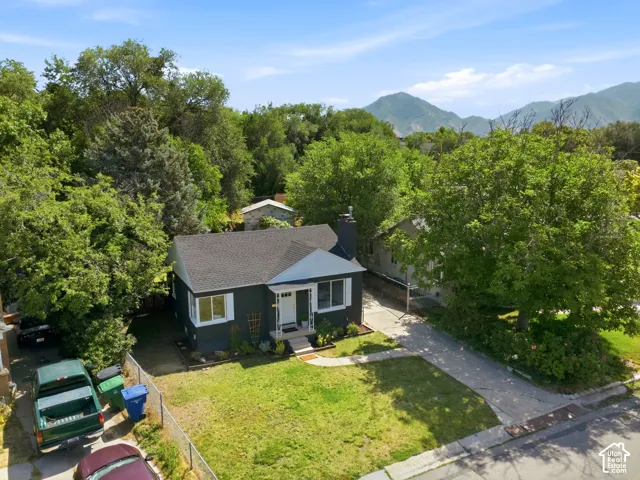 Charming single-story residence nestled on a generous lot surrounded by mature landscaping