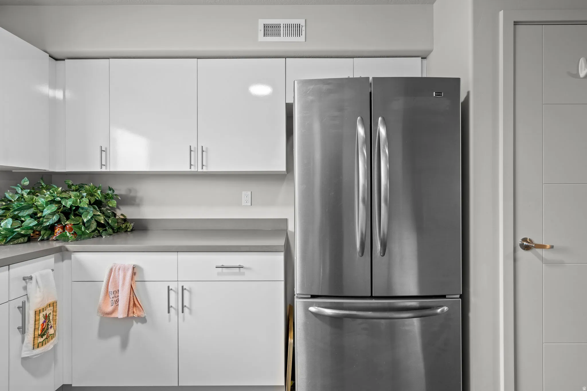 Stainless steel French door refrigerator with bottom freezer